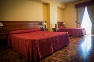 Postel nebo postele na pokoji v ubytování Albergo Ristorante Uliveto