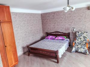 Кровать или кровати в номере Apartment On Moskovskaya 27