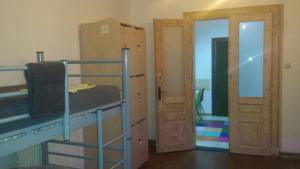 a room with two bunk beds and a door at Art Studio in Braşov