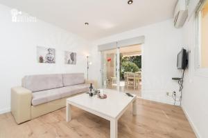 A seating area at Holiday apartament with direct access to the beach in Alcudia