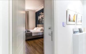 A bed or beds in a room at OTTO Rooms & Photogallery Még 37 kép