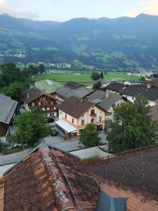 a view of a town with houses and mountains at Ferienwohnung Sailer in Fügen