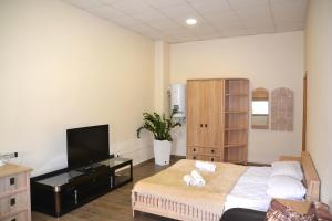 Postel nebo postele na pokoji v ubytování Coin Apartments & Poshtel