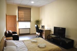 TV a/nebo společenská místnost v ubytování Coin Apartments & Poshtel