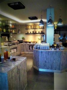 a large kitchen with wooden counters in a room at Star of Hin Nam Condominium in Hua Hin