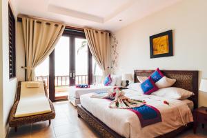Giường trong phòng chung tại Lotus Muine Resort & Spa