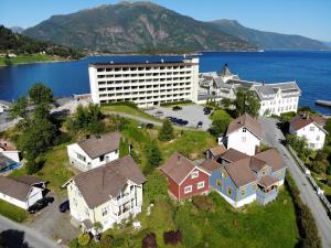 an aerial view of a town with houses and a building at Villa Holmen 2 - Ground floor apartment in Balestrand