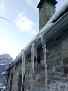 icicles hang from the roof of a house at Art Deco Bed & Breakfast in Dikorfo