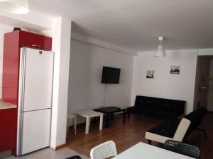 a living room with a couch and a refrigerator at Pozo izquierdo in Pozo Izquierdo