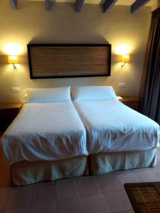 Postel nebo postele na pokoji v ubytování Beach Hotel Dos Mares
