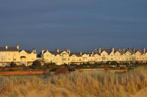 a row of large white houses on the beach at Aberley House in Liverpool