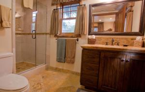 a bathroom with a sink and a shower and a toilet at Circle Bar B Guest Ranch in Santa Barbara