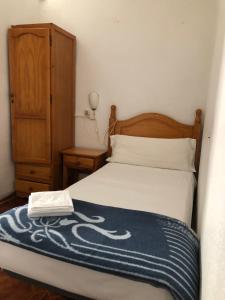 Postel nebo postele na pokoji v ubytování LÀtic Rooms
