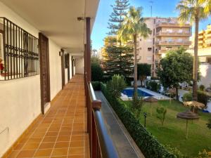 a balcony of a building with a view of a pool at Marbella Apartment in Marbella