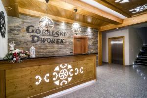 a lobby with a sign that reads complex divorce at Góralski Dworek in Białka Tatrzanska