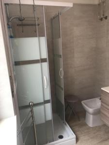 a glass shower in a bathroom with a toilet at A Casa di Nunzi in Tropea