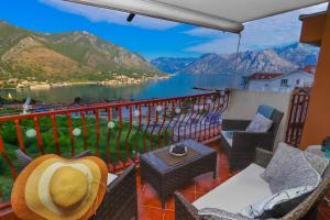 a balcony with a view of a lake and mountains at Apartment Sea View in Kotor