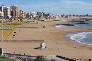 
a beach with a large body of water at Hotel Bosnia in Mar del Plata
