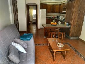 a living room with a couch and a table at Apartamentos El Jablito in Frontera