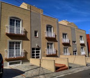 a building with balconies on the side of it at Apartamentos El Jablito in Frontera