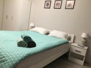 Postel nebo postele na pokoji v ubytování Софиевский квартал