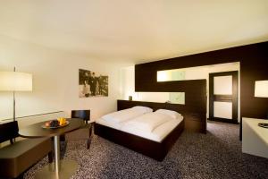 Tempat tidur dalam kamar di Hotel Rauter