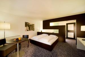 Postel nebo postele na pokoji v ubytování Geniesserhotel Rauter