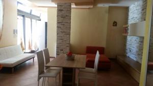 a living room with a table and a couch at Sole&Mare in Monopoli