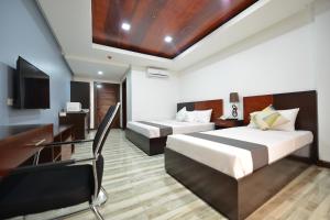 Postel nebo postele na pokoji v ubytování Hotel Gabriella