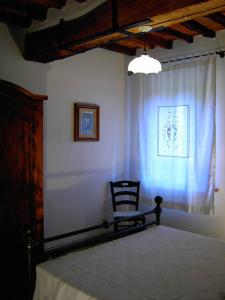 Postel nebo postele na pokoji v ubytování Appartamenti La Rocca
