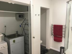 a bathroom with a sink and a toilet at Smart Apartment in Dinsdale
