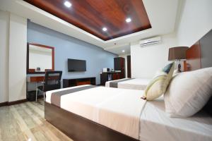 Postel nebo postele na pokoji v ubytování Hotel Gabriella