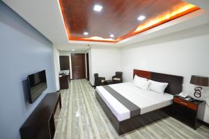 Postel nebo postele na pokoji v ubytování Hotel Gabriella