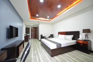 TV a/nebo společenská místnost v ubytování Hotel Gabriella