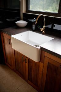a sink in a bathroom with a window at Adventure Bay Retreat Bruny Island in Adventure Bay