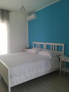 Postel nebo postele na pokoji v ubytování Brezza Del Mare