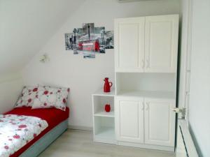 Posteľ alebo postele v izbe v ubytovaní Flair Apartmanház