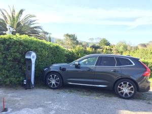 a car parked next to a parking meter at Arli Hotel Hideaway Punta Ala - Adults Only in Punta Ala