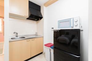 Kuchyň nebo kuchyňský kout v ubytování GuestHouse MIYABI