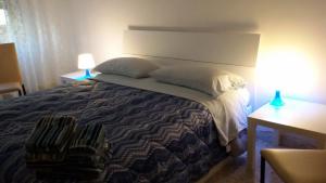Postel nebo postele na pokoji v ubytování B&B Metropolitan Taranto