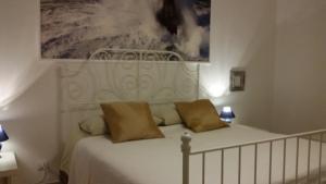 Postel nebo postele na pokoji v ubytování B&B Metropolitan Taranto