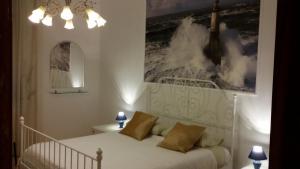 Postel nebo postele na pokoji v ubytování B&B Metropolitan Taranto