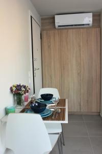 a table with plates and bowls on it in a room at Xenon Loft in Athens