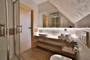 Kúpeľňa v ubytovaní Apartamenty Kościelisko + 37 fotografií