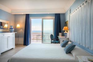 Postel nebo postele na pokoji v ubytování Lu' Hotel Riviera - Carloforte