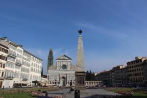 a monument in front of a building with a tower at Ricale in Florence
