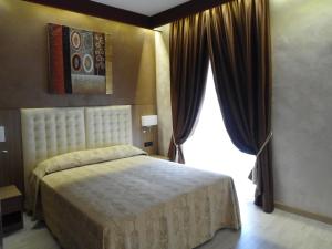 Postel nebo postele na pokoji v ubytování Hotel Continental