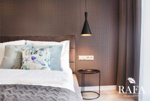 Posteľ alebo postele v izbe v ubytovaní RAFA Apartments