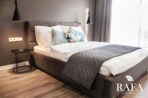 Posteľ alebo postele v izbe v ubytovaní RAFA Apartments