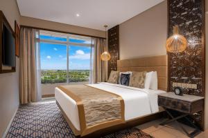 Neelkanth Sarovar Premiere客房内的一张或多张床位